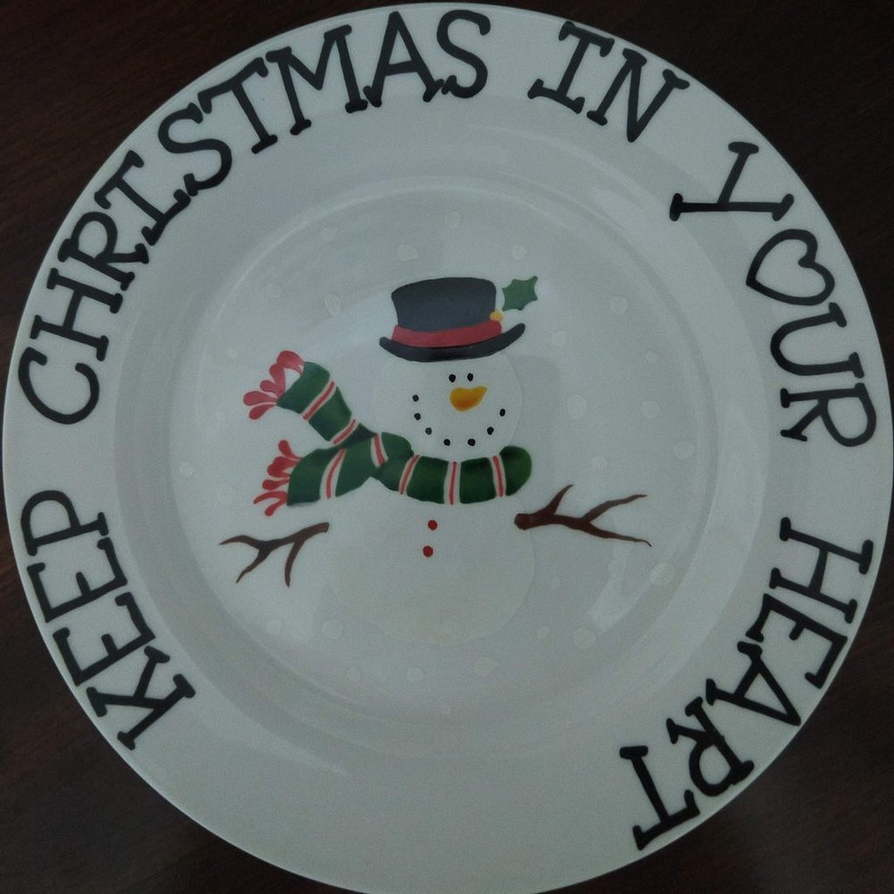 Two snowman and one Santa cookie plates.